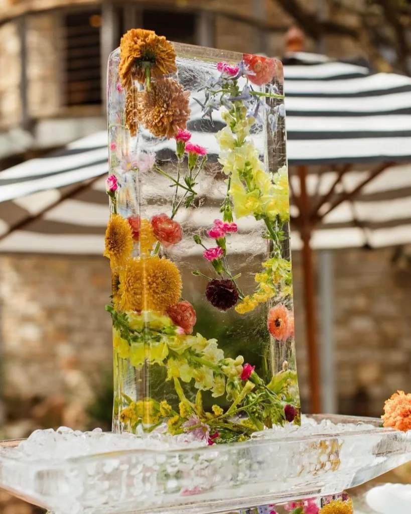 Make the crown jewel of your cocktail hour a custom ice sculpture from full_spectrum_ice⁠! This frozen floral design is one